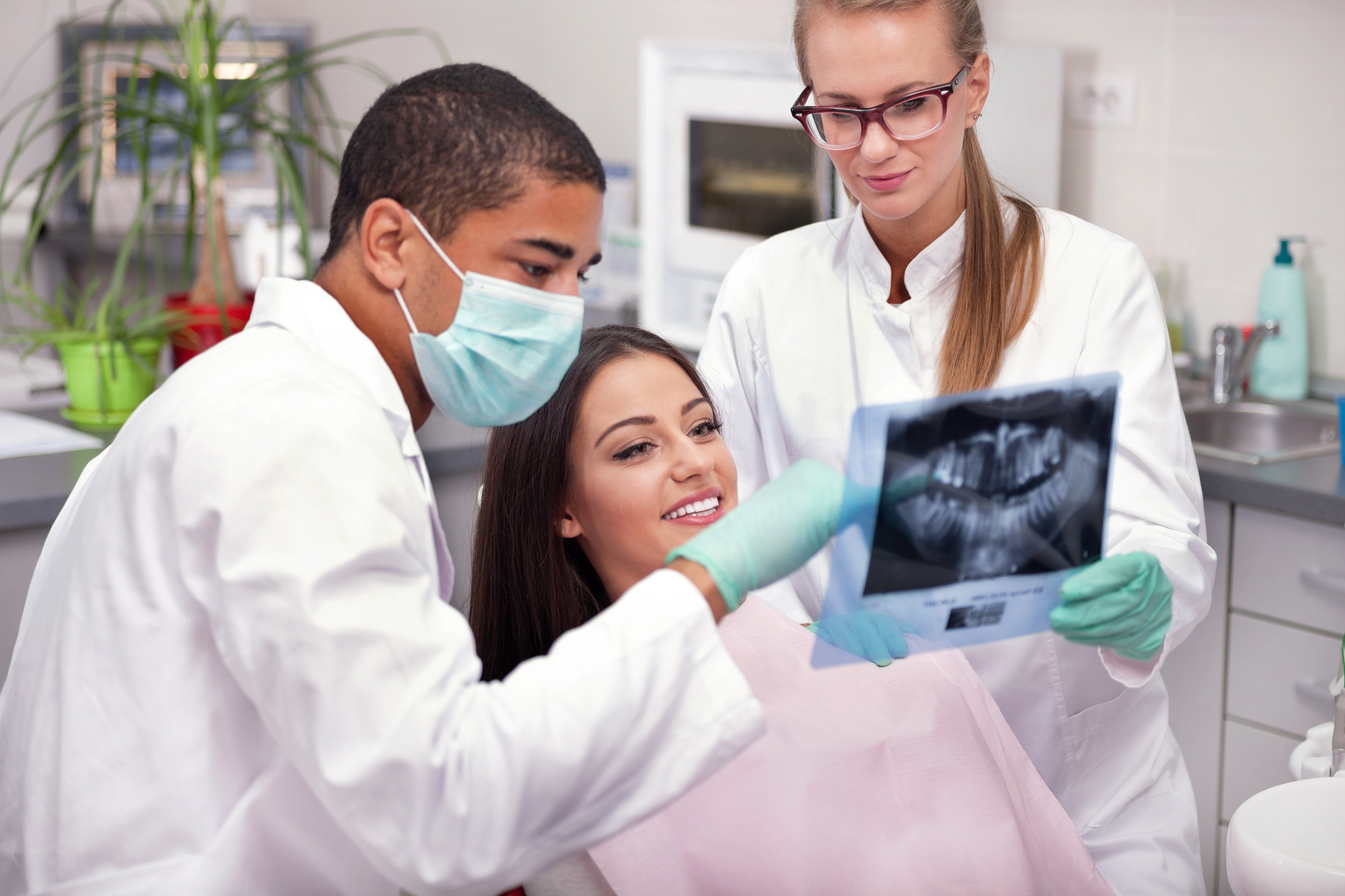 patient looking at scan with dentist