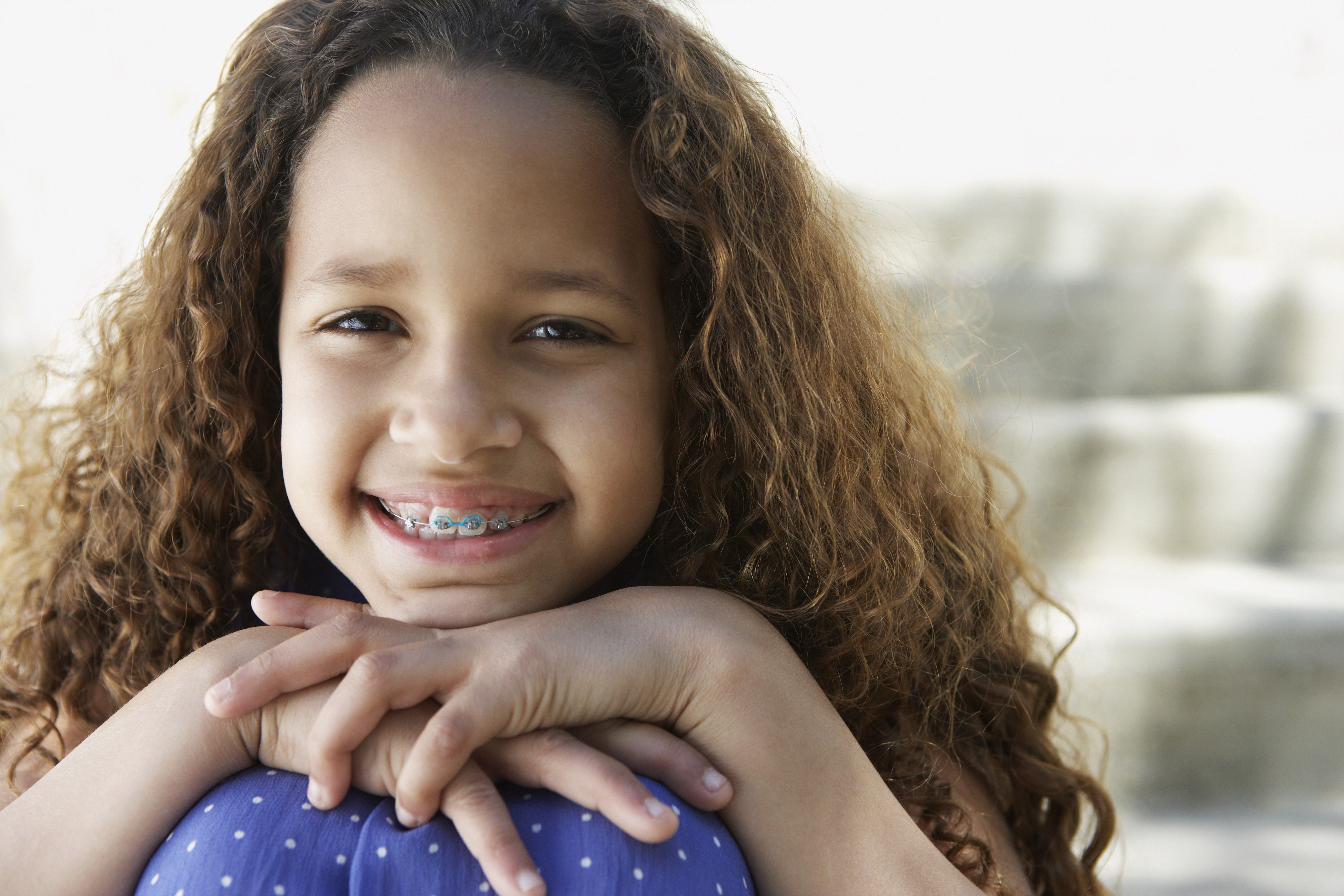 young girl smiling with braces